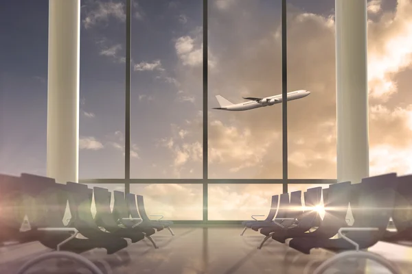 Airplane flying past window — Stock Photo, Image