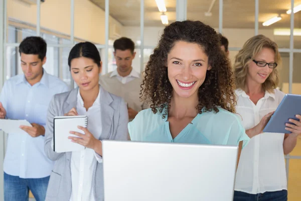 Boss standing in front of her team — Stock Photo, Image