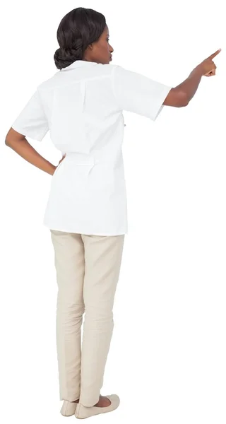 Nurse in tunic pointing — Stock Photo, Image