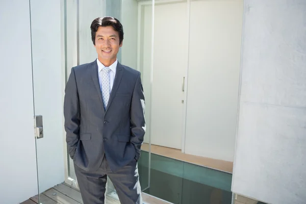 Confident estate agent standing at front door — Stock Photo, Image