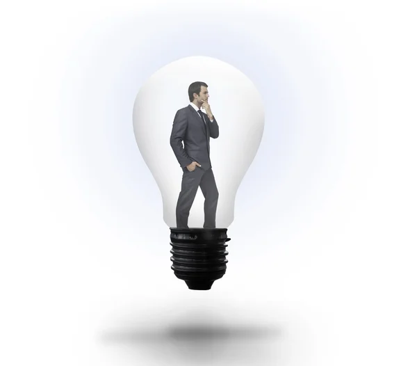 Thinking businessman in light bulb — Stock Photo, Image