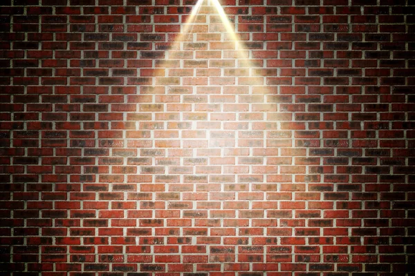 Red brick wall under spotlight — Stock Photo, Image