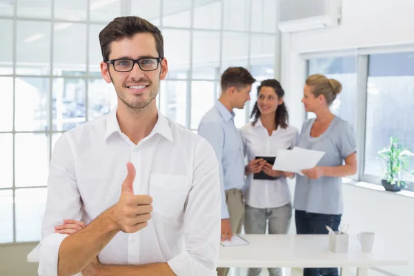 Businessman giving thumbs up — Stock Photo, Image