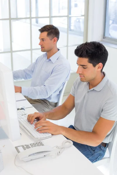 Businessmen working at desk — Stock Photo, Image