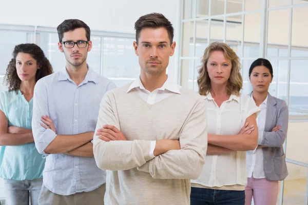 Casual business team with arms crossed — Stock Photo, Image