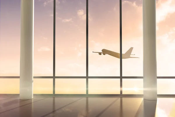 Airplane flying past window — Stock Photo, Image