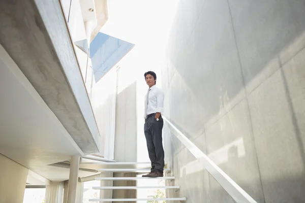 Man standing with hands in pockets — Stock Photo, Image