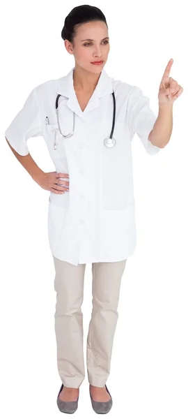 Pretty nurse pointing — Stock Photo, Image