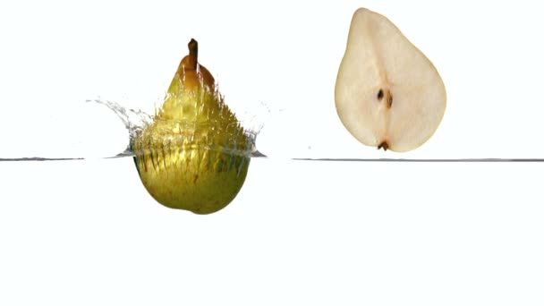 Pear segments plunging into water — Stock Video