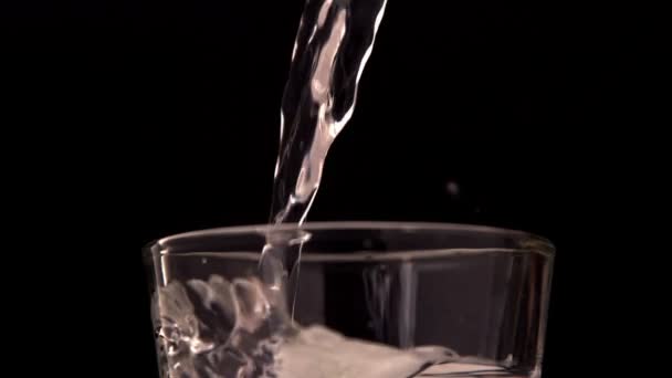 Water pouring into a glass — Stock Video