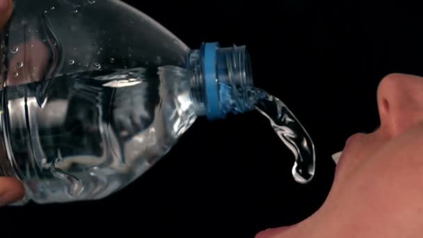 Woman pouring water into her mouth — Stock Video