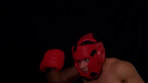 Tough boxer punching with gloves — Stock Video