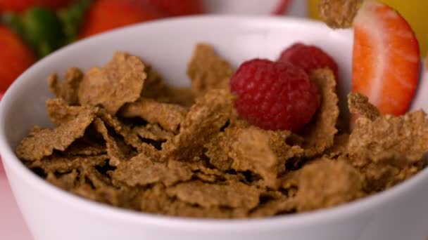 Berries pouring into cereal bowl — Stock Video