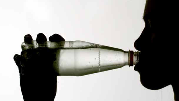 Woman drinking from bottle — Stock Video