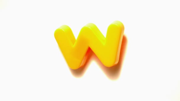 Yellow letter w lifting off — Stock Video