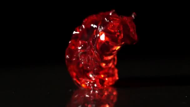 Red jelly falling and bouncing — Stock Video