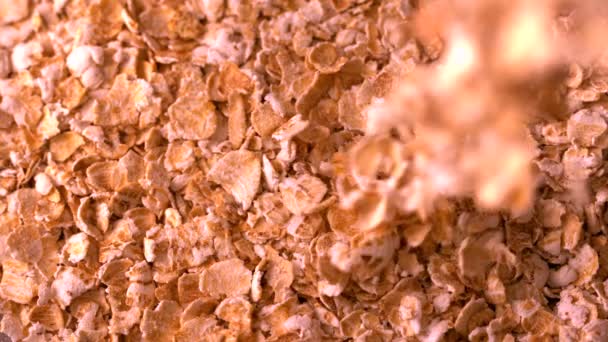 Cereal flakes pouring onto more — Stock Video