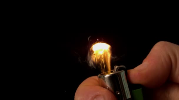 Hand lighting a lighter — Stock Video