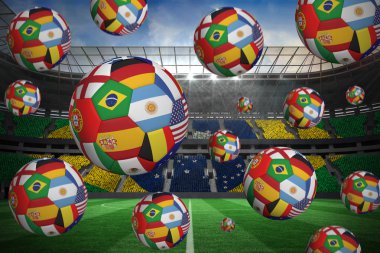 Composite image of footballs in international flags clipart