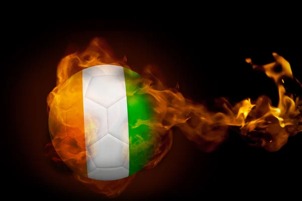 Composite image of fire surrounding ivory coast ball — Stock Photo, Image