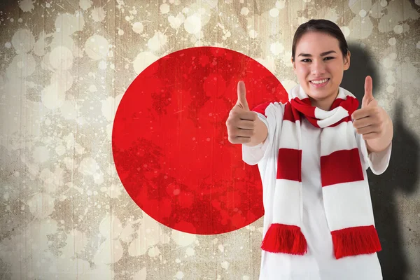 Football fan in white wearing scarf showing thumbs up — Stock Photo, Image