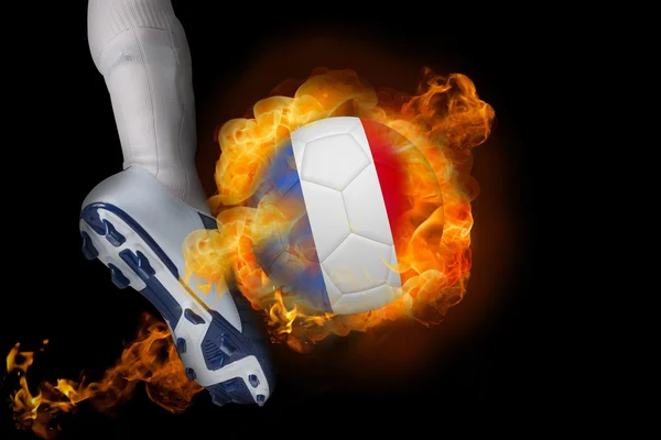 Football player kicking flaming france ball — Stock Photo, Image