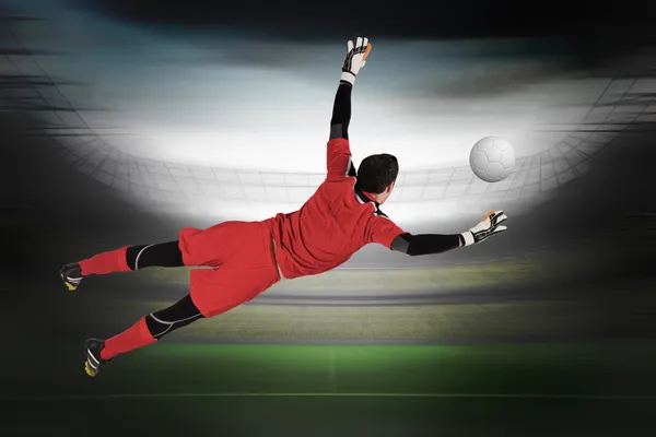 Composite image of fit goal keeper jumping up — Stock Photo, Image