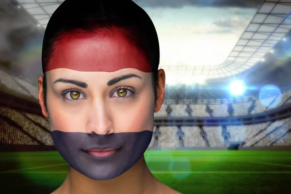 Composite image of beautiful netherlands fan in face paint — Stock Photo, Image