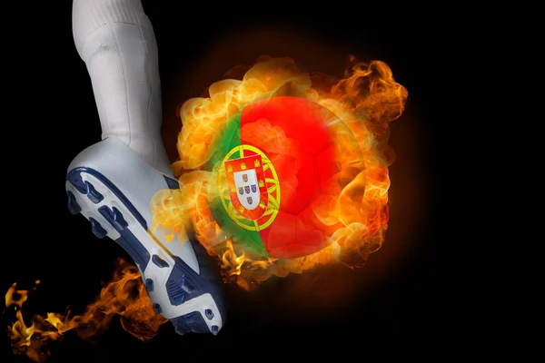 Football player kicking flaming portugal ball — Stock Photo, Image