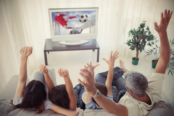 Family cheering and watching the world cup at home — Stock Photo, Image