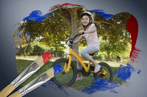 Složený obraz holčička na kole — Stock fotografie