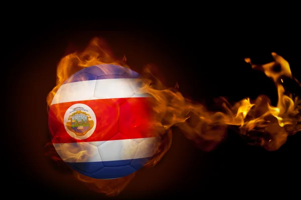 Composite image of fire surrounding costa rica ball — Stock Photo, Image