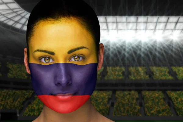 Composite image of beautiful colombia fan in face paint — Stock Photo, Image