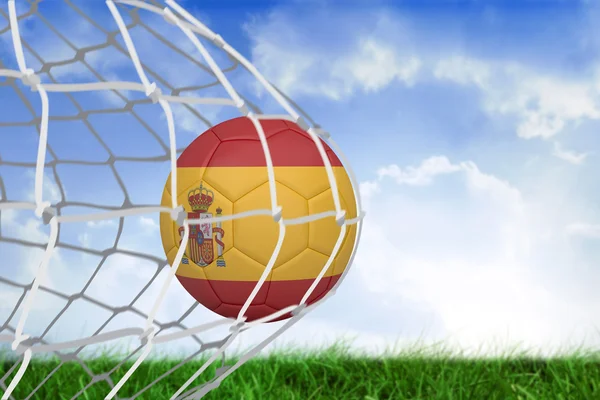 Composite image of football in spain colours at back of net — Stock Photo, Image