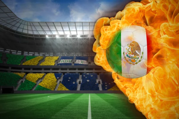 Composite image of fire surrounding mexico flag football — Stock Photo, Image