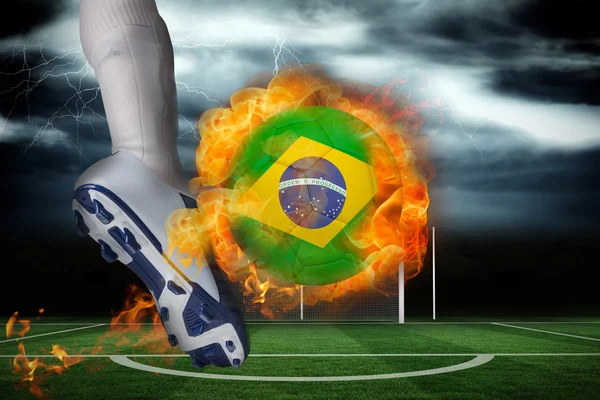 Football player kicking flaming brasil flag ball — Stock Photo, Image