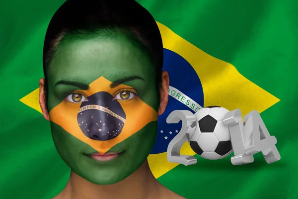 Imagem composta do torcedor de futebol brasileiro em pintura facial — Fotografia de Stock