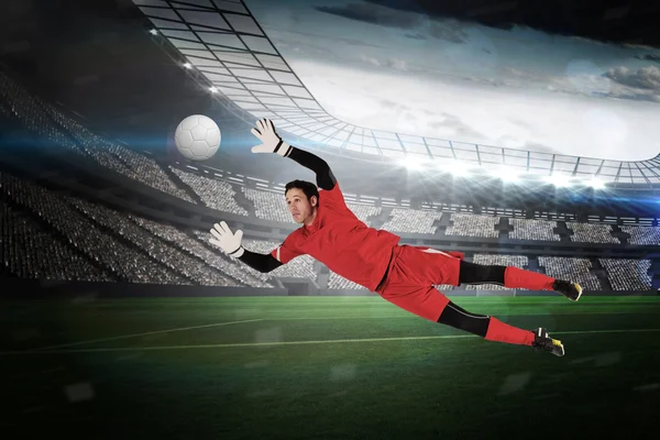 Composite image of fit goal keeper jumping up — Stock Photo, Image