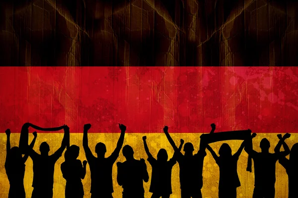 Composite image of silhouettes of football supporters — Stock Photo, Image