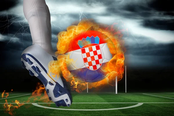 Football player kicking flaming croatia flag ball — Stock Photo, Image