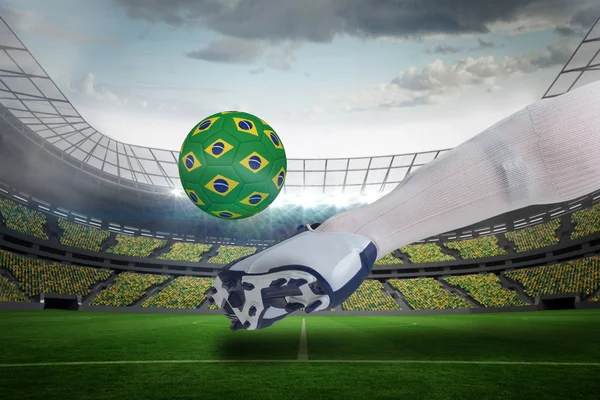 Close up of football player kicking brasil ball — Stock Photo, Image