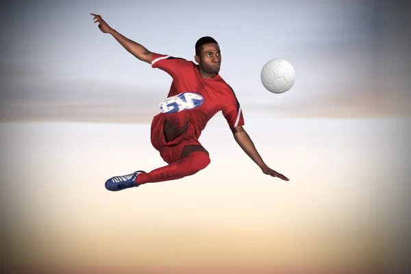 Imagen compuesta de jugador de fútbol en rojo patadas —  Fotos de Stock