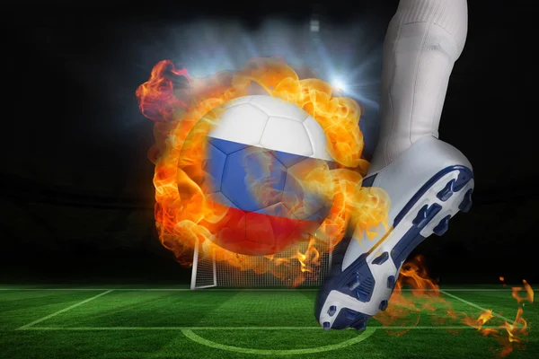 Football player kicking flaming russia flag ball — Stock Photo, Image