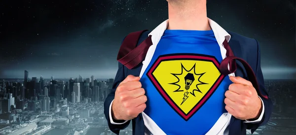 Businessman opening shirt in superhero style — Stock Photo, Image