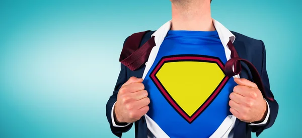 Businessman opening shirt in superhero style — Stock Photo, Image