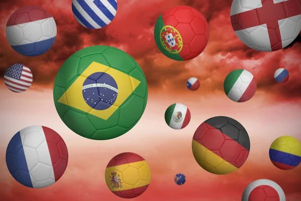 Image composite de ballons de football en différentes couleurs de drapeau — Photo