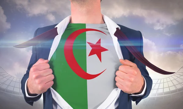 Businessman opening shirt to reveal algeria flag — Stock Photo, Image