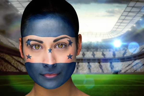 Composite image of beautiful honduras fan in face paint — Stock Photo, Image