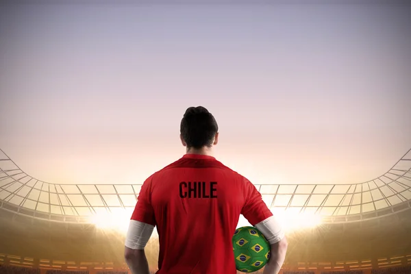 Composite image of chile football player holding ball — Stock Photo, Image