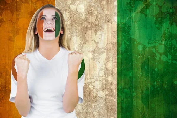 Excited ivory coast fan in face paint — Stock Photo, Image